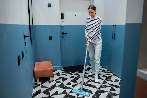 Sweep or Vacuum the Tiles